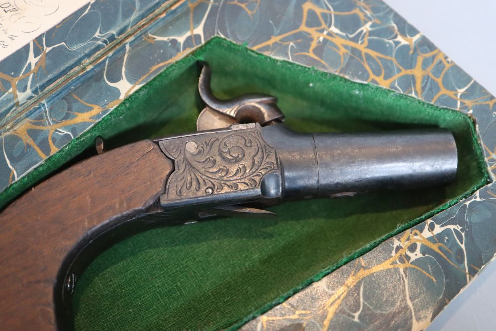 A 19th century boxlock percussion pistol concealed in a copy of Forty Five Guardsmen
